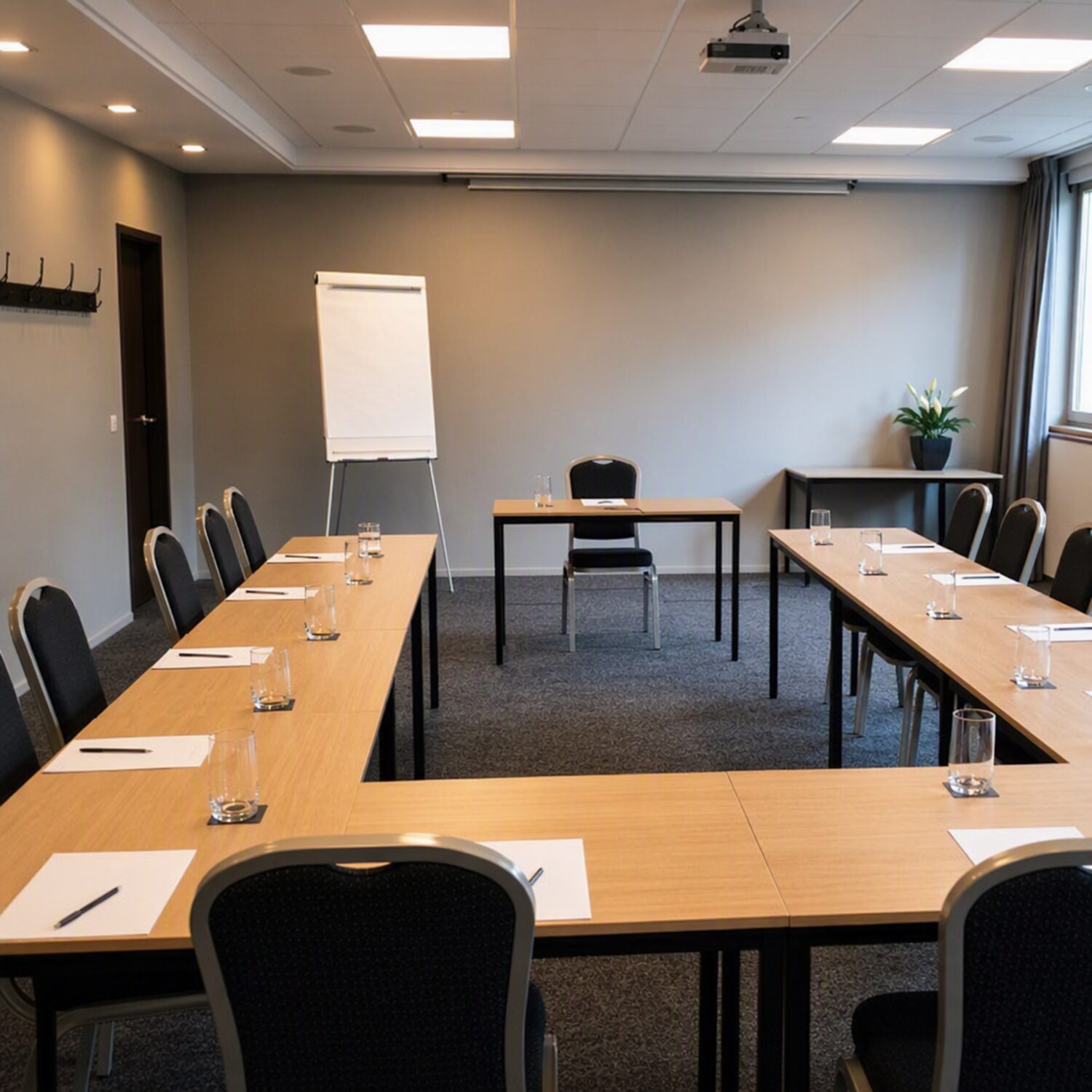 A training room set up with a flipchart