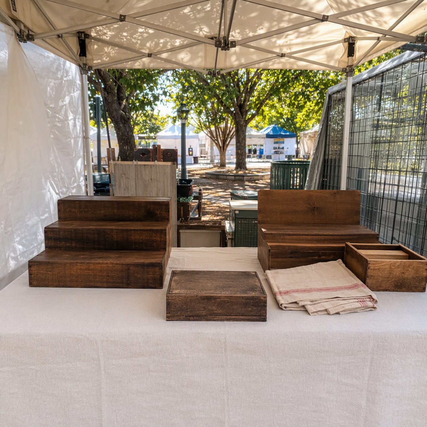 An empty market stall with wooden risers