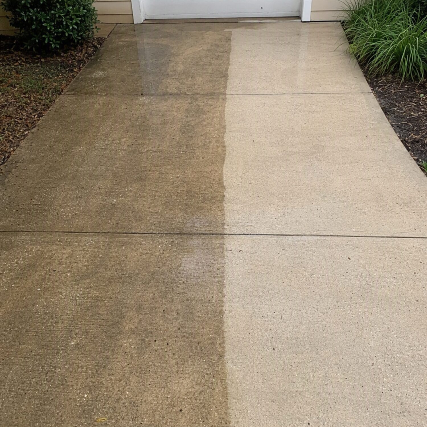 A driveway half cleaned with a sharp dividing line