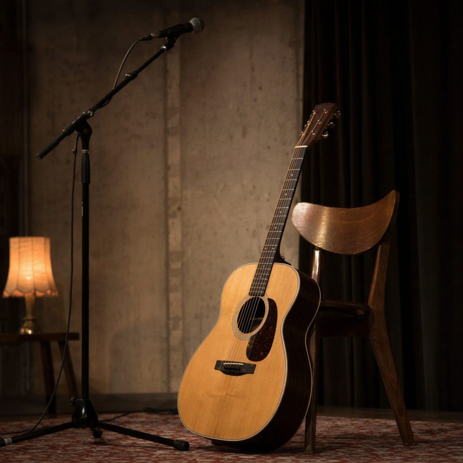 A guitar leaning beside a mic stand