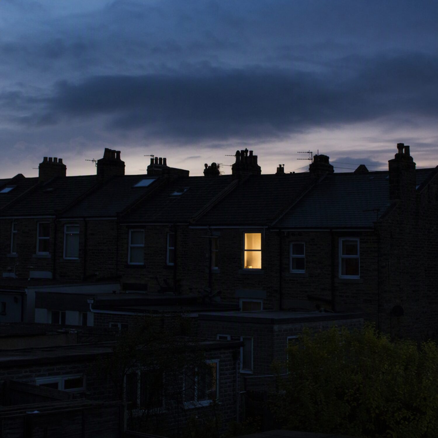 One lit window in a dark terrace
