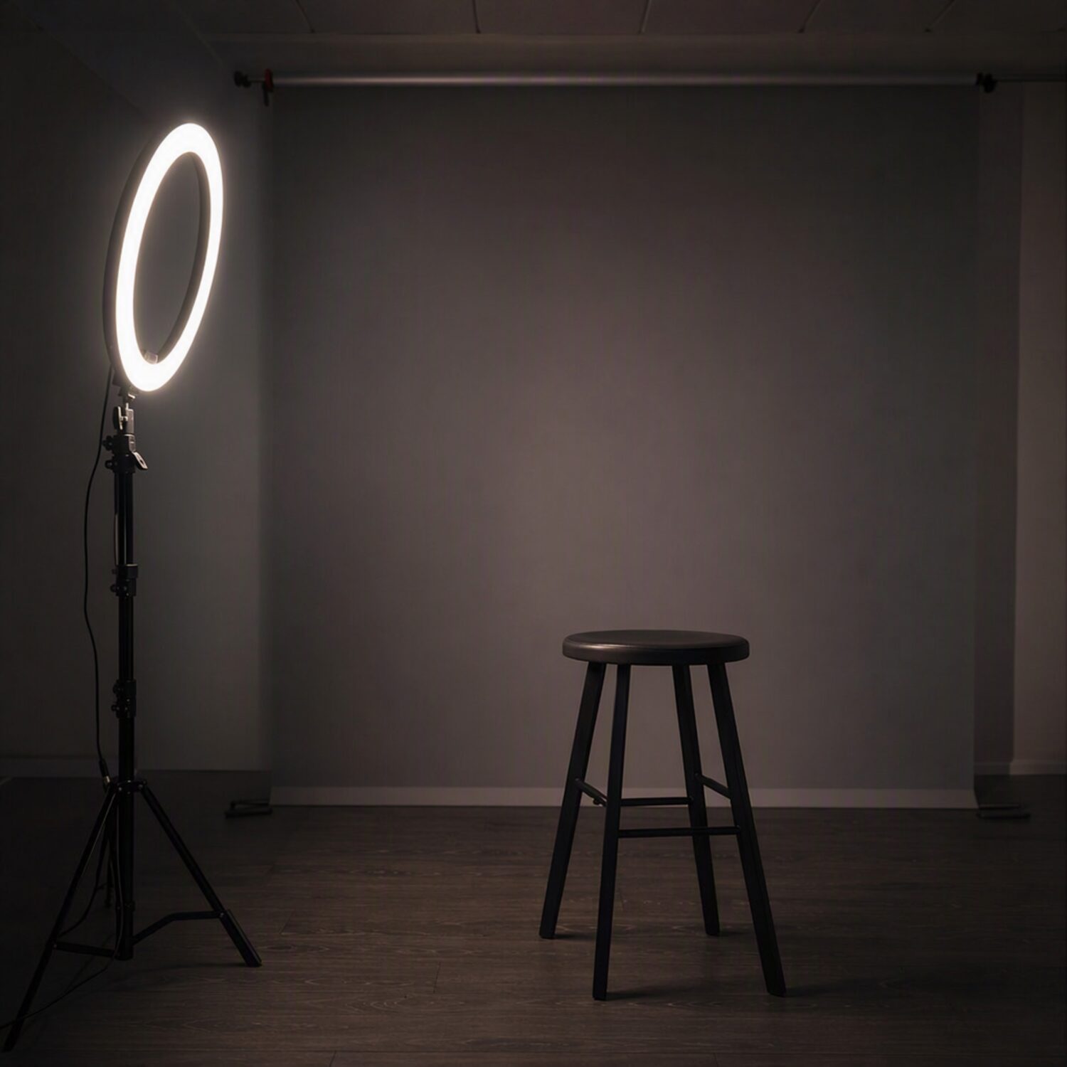 A ring light facing an empty stool
