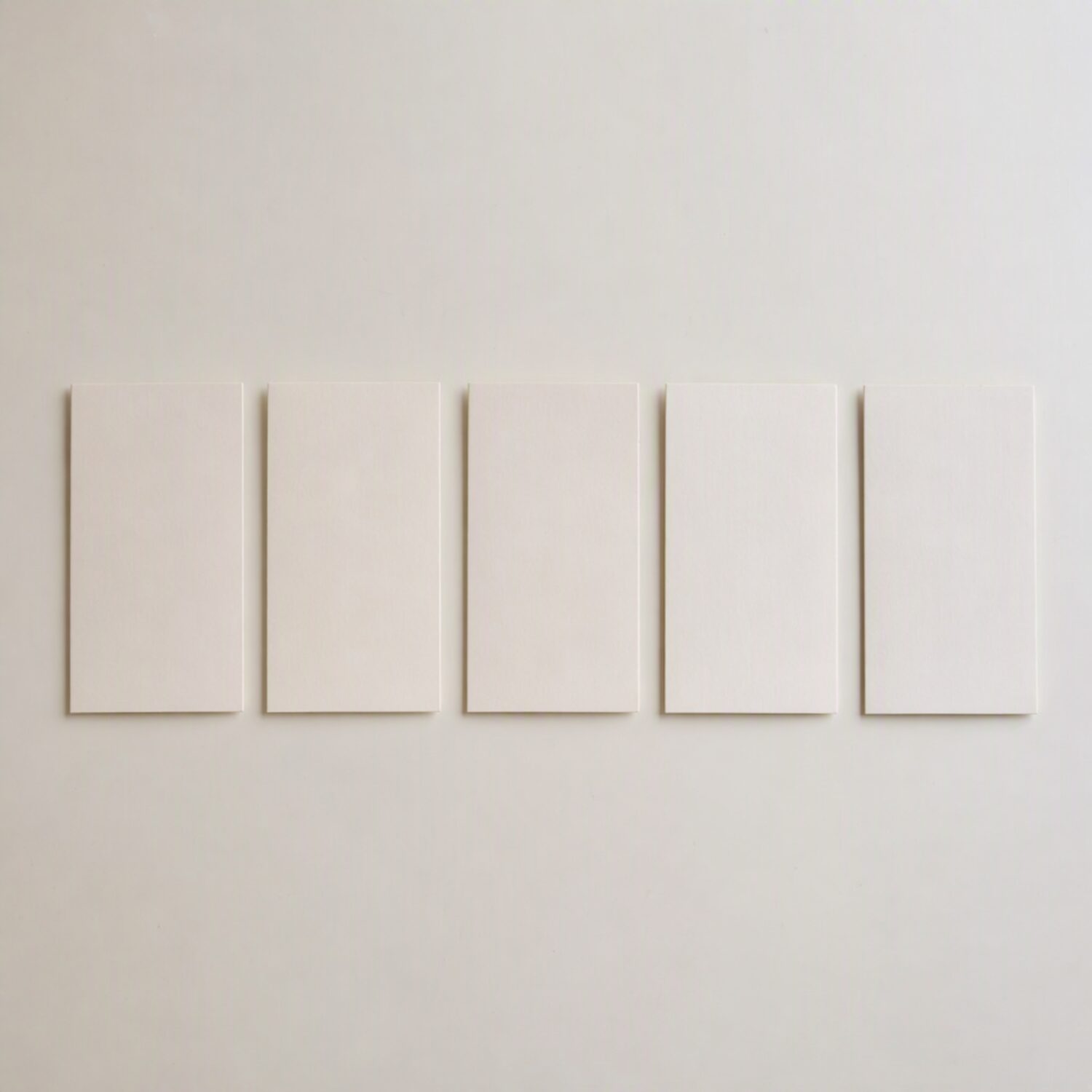 Five paper cards in a row