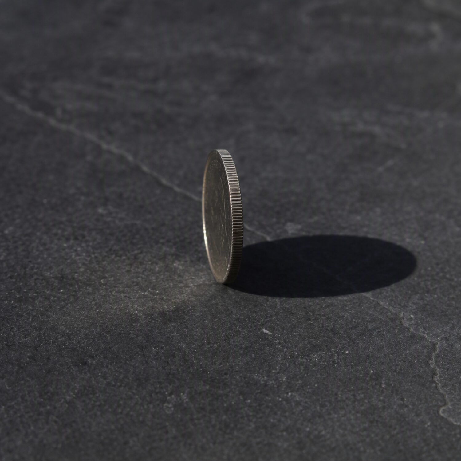 A coin balanced on its edge