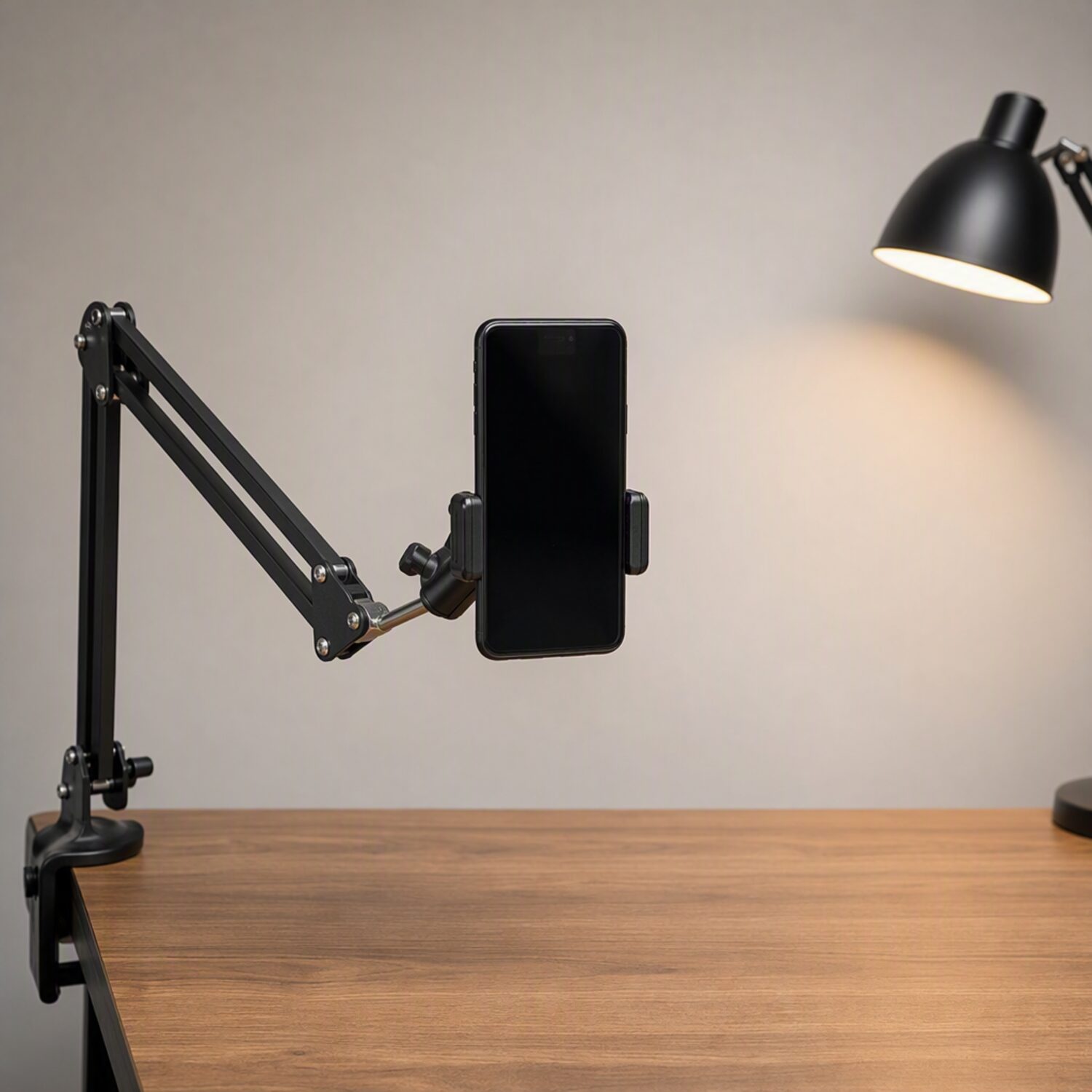 A phone clamped to a desk arm
