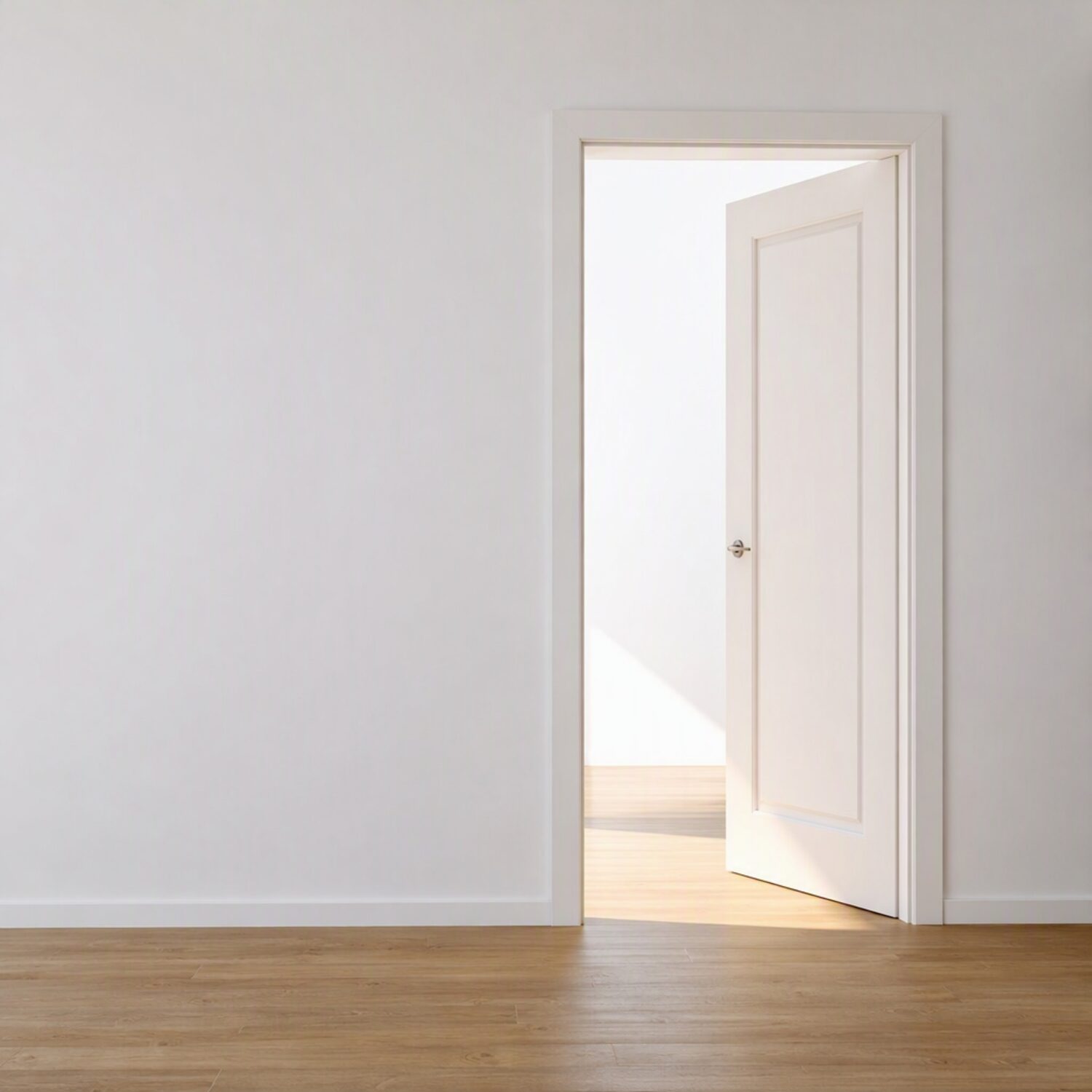 An open door with daylight on the floor